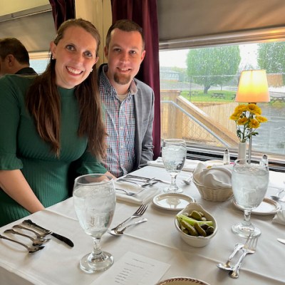 a group of people sitting at a table with wine glasses