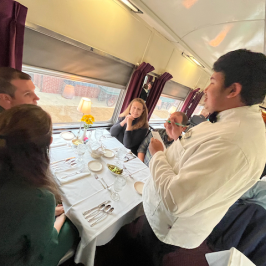 a group of people sitting at a table