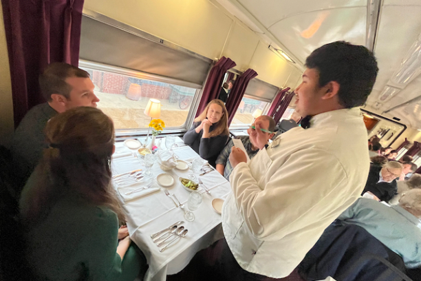 a group of people sitting at a table