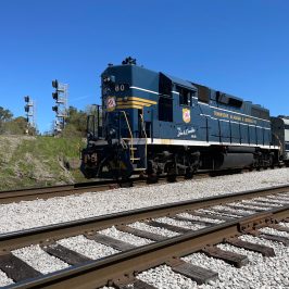 Tag 80 engine is a train traveling down the train tracks in Chattanooga. This image is perfect for those who are interested in the Tennessee Valley Railroad Museum, as it captures the local mission Ridge Train in all of its glory.