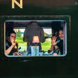 Guests enjoying dinner inside a vintage dining car on the Chattanooga Dinner Train