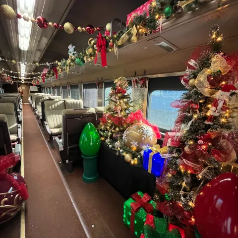 View from inside Santa’s Car showing holiday lights through the window.