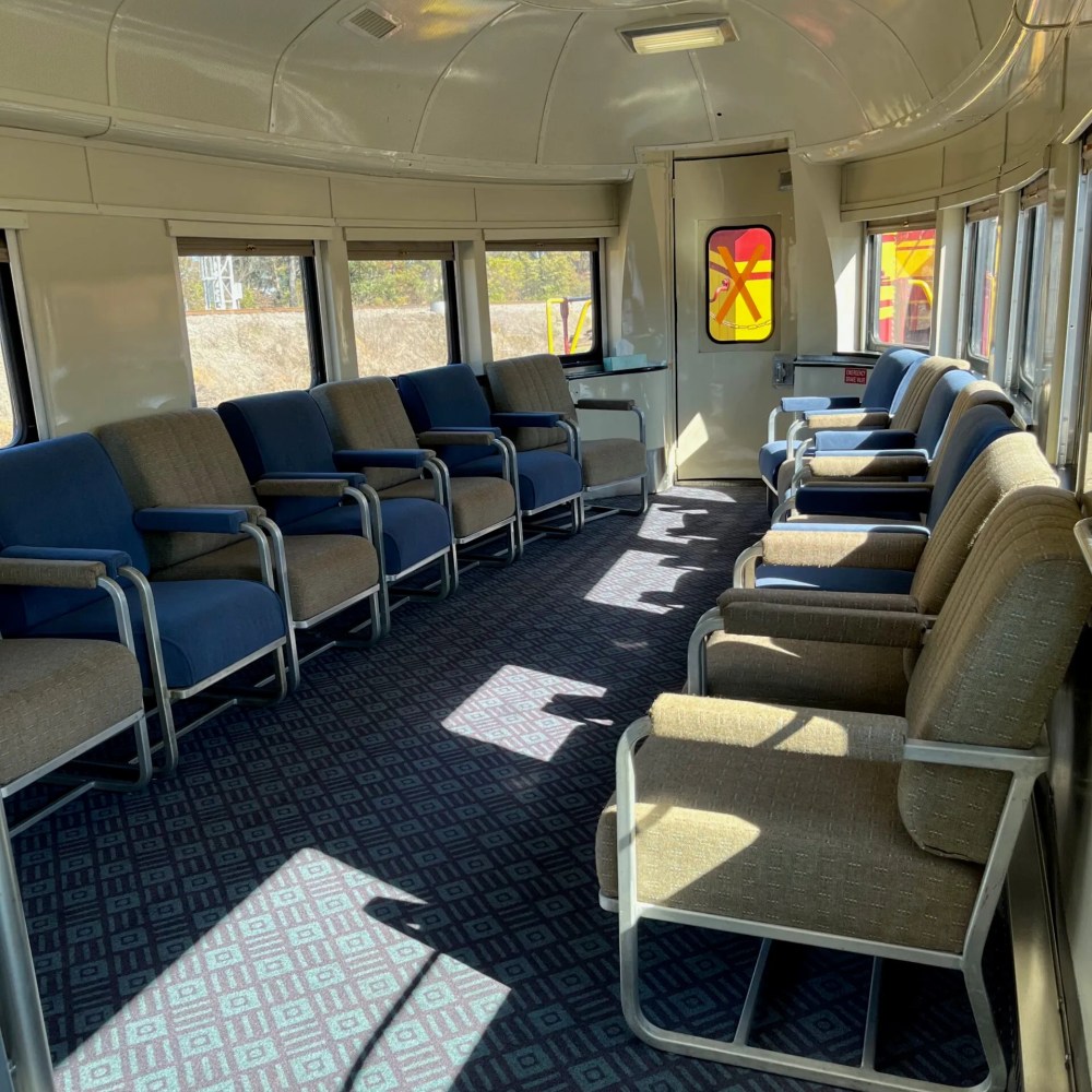 Observation Car seating aboard the Hiwassee Loop Train Ride featuring large windows and panoramic sightseeing views