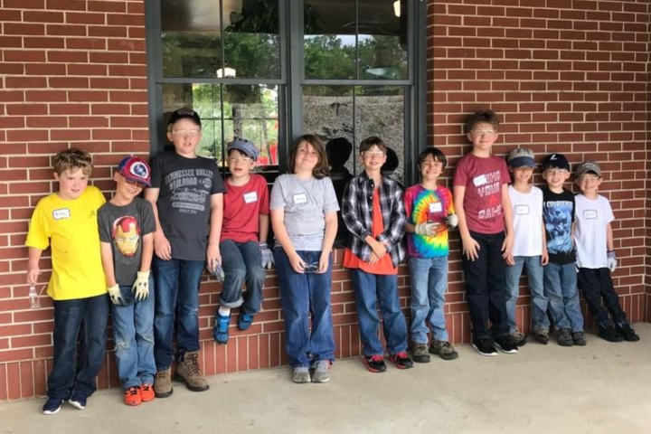a group of people standing in front of a building