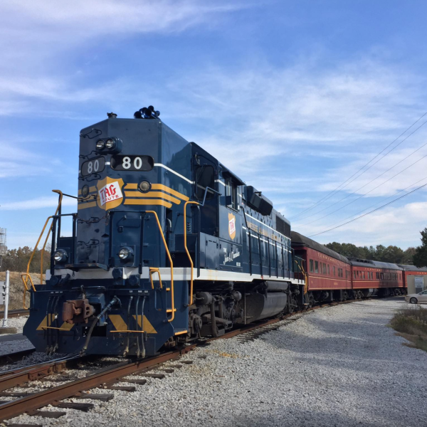 This 80 train engine is quite a sight to see. It's massive and can easily pull a few cars behind it. It's definitely something you don't see everyday!