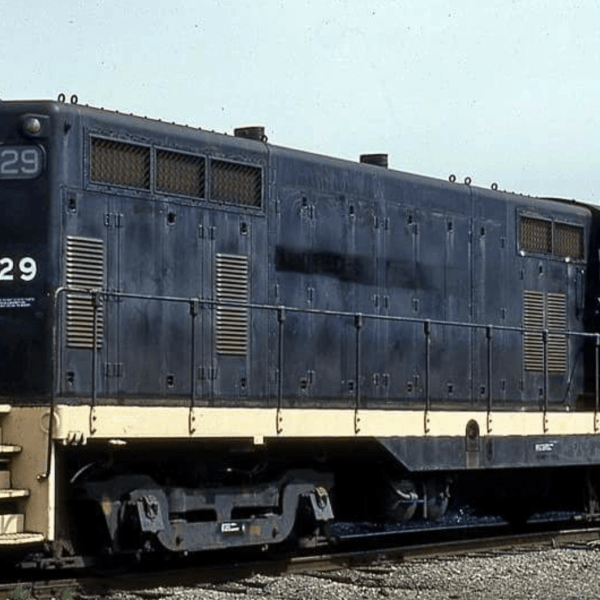 a train is parked on the side of a truck