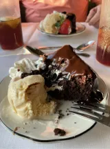 a piece of cake and ice cream on a plate