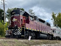a train engine carrying carts down a track