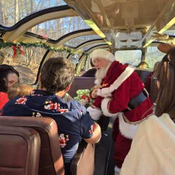 Santa Claus greeting children aboard Santa’s Hiwassee Train Ride