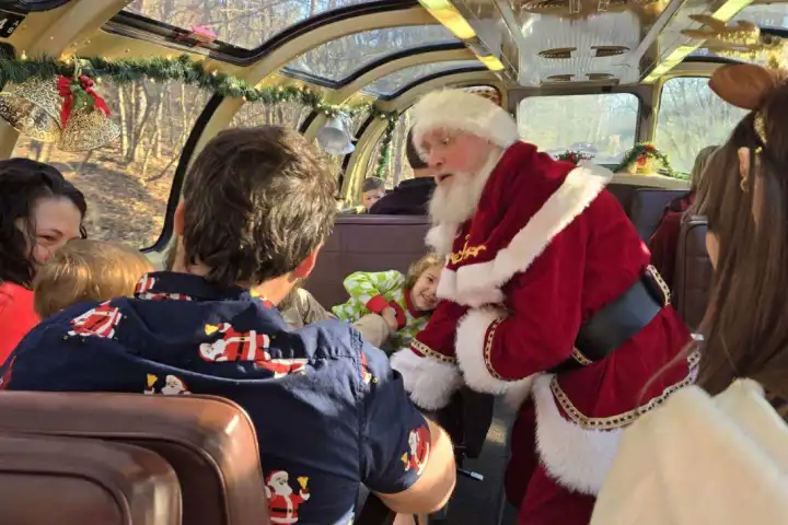 Santa Claus greeting children aboard Santa’s Hiwassee Train Ride