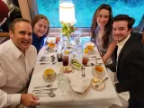 Couples enjoying a romantic seating arrangement on the Tennessee Valley Railroad Museum's dinner train in Chattanooga, creating a memorable dining experience.