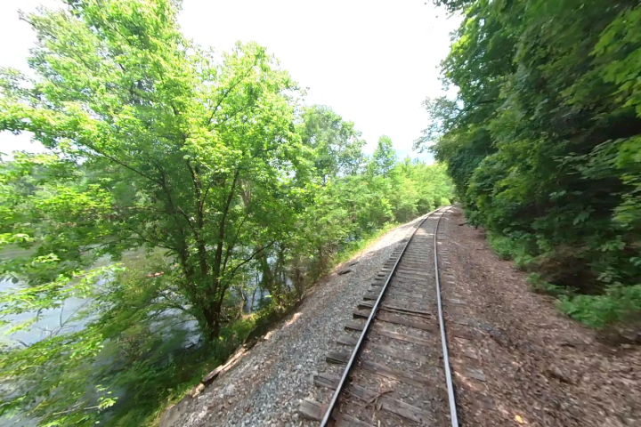 The Hiwassee River Rail Adventure is a unique experience that allows passengers to travel down train tracks near a forest. The views are beautiful and the experience is one-of-a-kind.