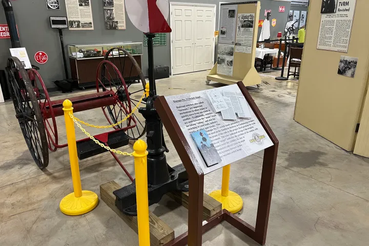 a bicycle is parked next to a sign