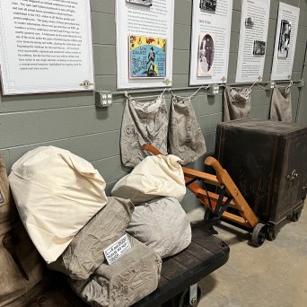 Experience the intrigue of the 1920s railway postal service with our display featuring an antique safe and mail bags at the Tennessee Valley Railroad Museum.