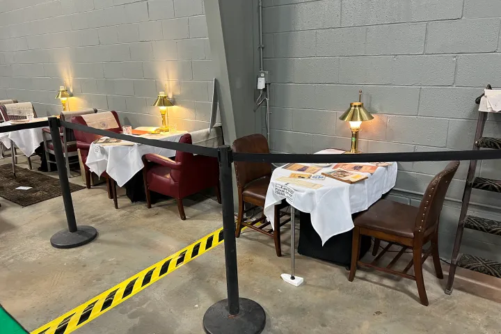 a group of people sitting in chairs in a room