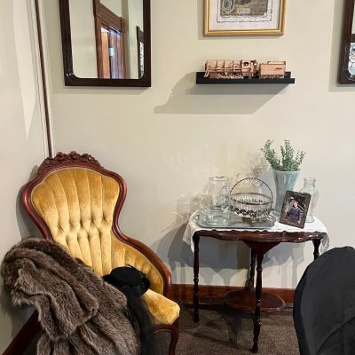 The Tennessee Valley Railroad Museum in Chattanooga is a great place to learn about the history of railroads in the area. This charming museum features a chair with a table set up with flowers, making for a picturesque scene.