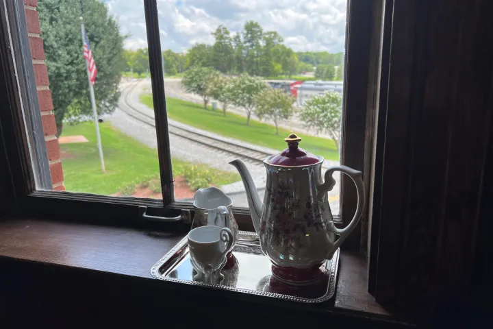 Tea Room - a vase sitting on top of a window