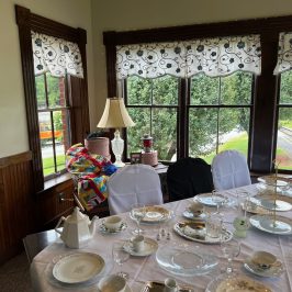 a dining room table filled with wine glasses