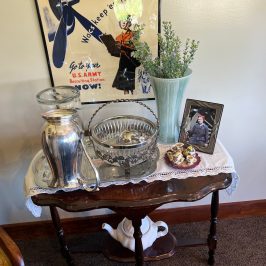 Tennessee Valley Railroad Museum - Chattanooga - Homefront Tea Room - This room is filled with beautiful furniture and a vase of fresh flowers on the table.