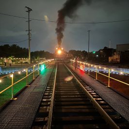 a large long train on a steel track