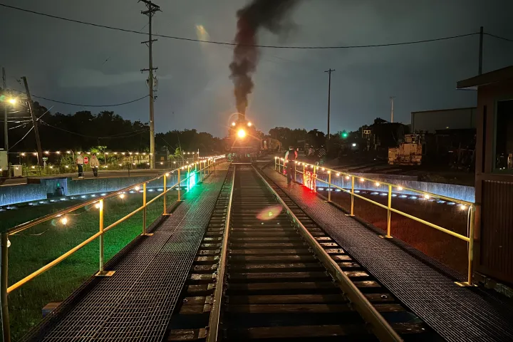 a large long train on a steel track