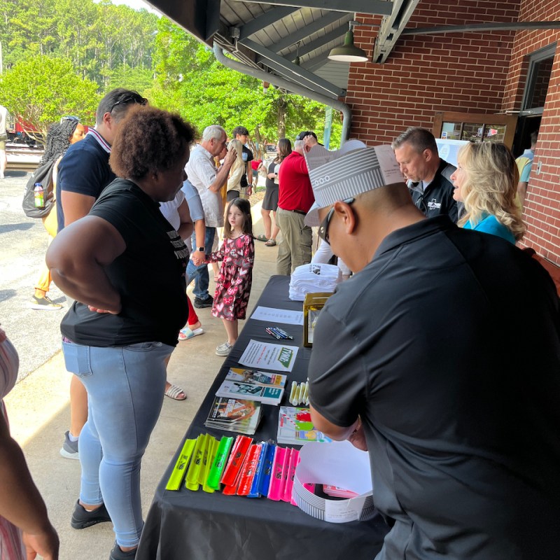a group of people that are talking to each other