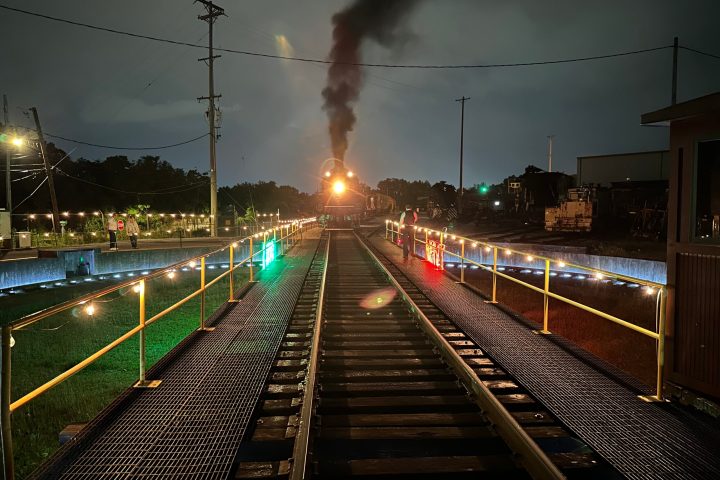 a large long train on a steel track