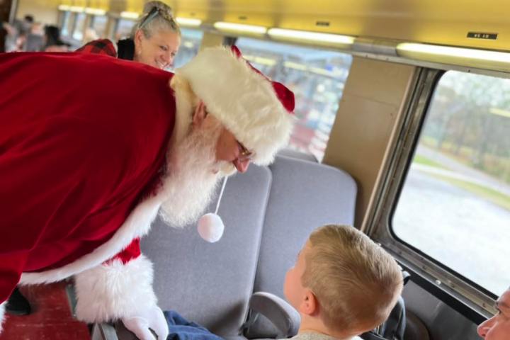 a group of people sitting at a train station