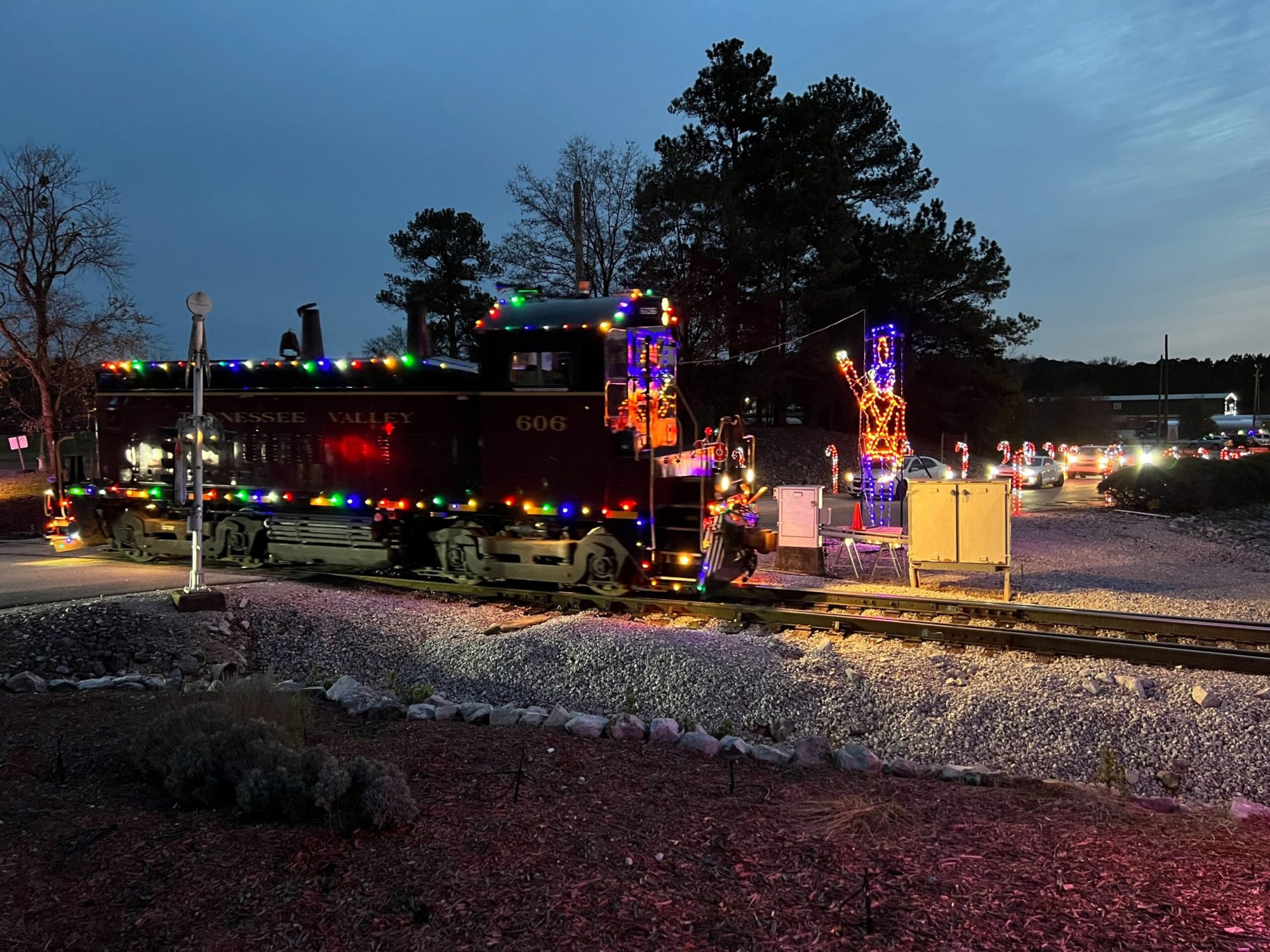 a group of people standing in a parking lot