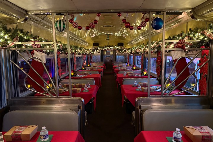 Santa greeting guests aboard the Nightcap With St. Nick holiday train at Tennessee Valley Railroad Museum.