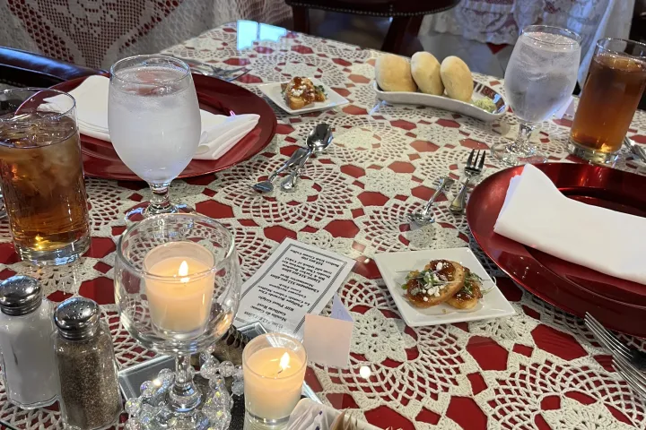 a table topped with plates of food