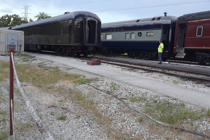 Three railcars, all restored to era appropriate livery. Is this 1955 or 2025?