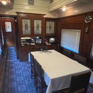 The restored (circa 1955-66 appearance) dining room of office car 98.