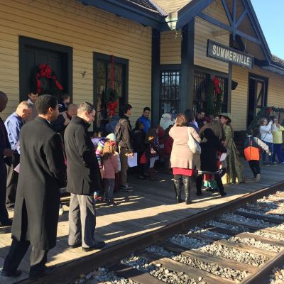 Guests line up outside the Summerville Depot to board the Santa Special holiday train.