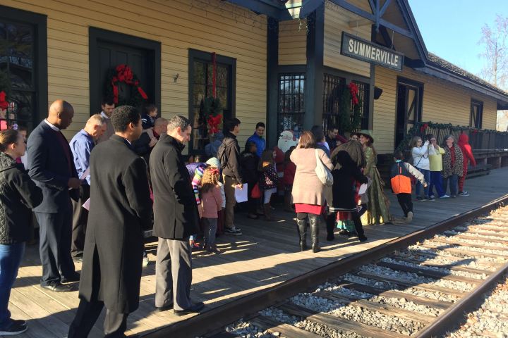 Guests line up outside the Summerville Depot to board the Santa Special holiday train.