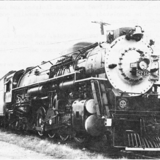 Historic black-and-white photograph of Chesapeake & Ohio steam locomotive No. 2716 on railroad tracks at the Tennessee Valley Railroad Museum.