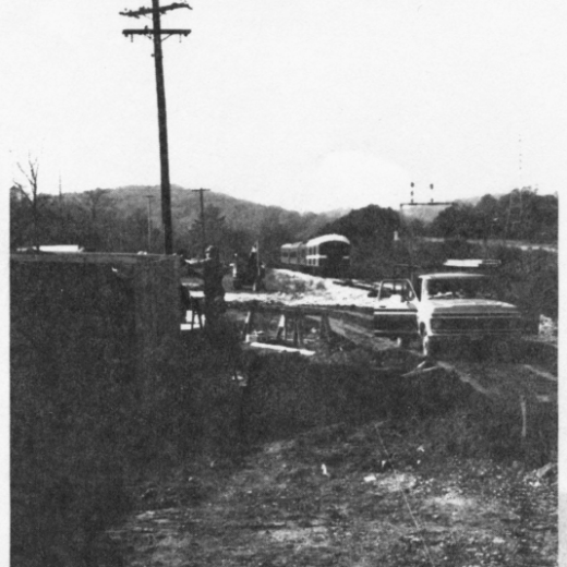 Historic construction site showing early earthwork and vehicles during development of the Tennessee Valley Railroad Museum grounds.